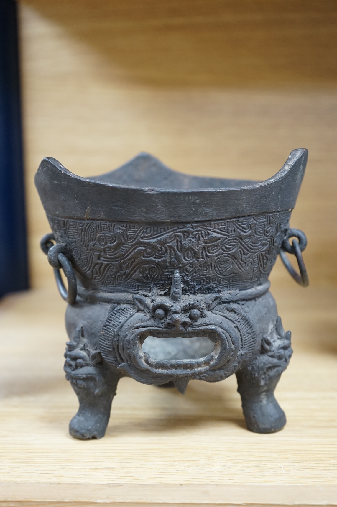 A Chinese or Japanese archaistic bronze censer, 16cm high